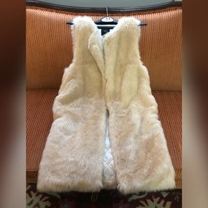 Brand new, cream colored soft long faux fur vest